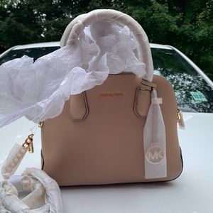 This bag is BN with tags.  Michael K. Oyster NS
